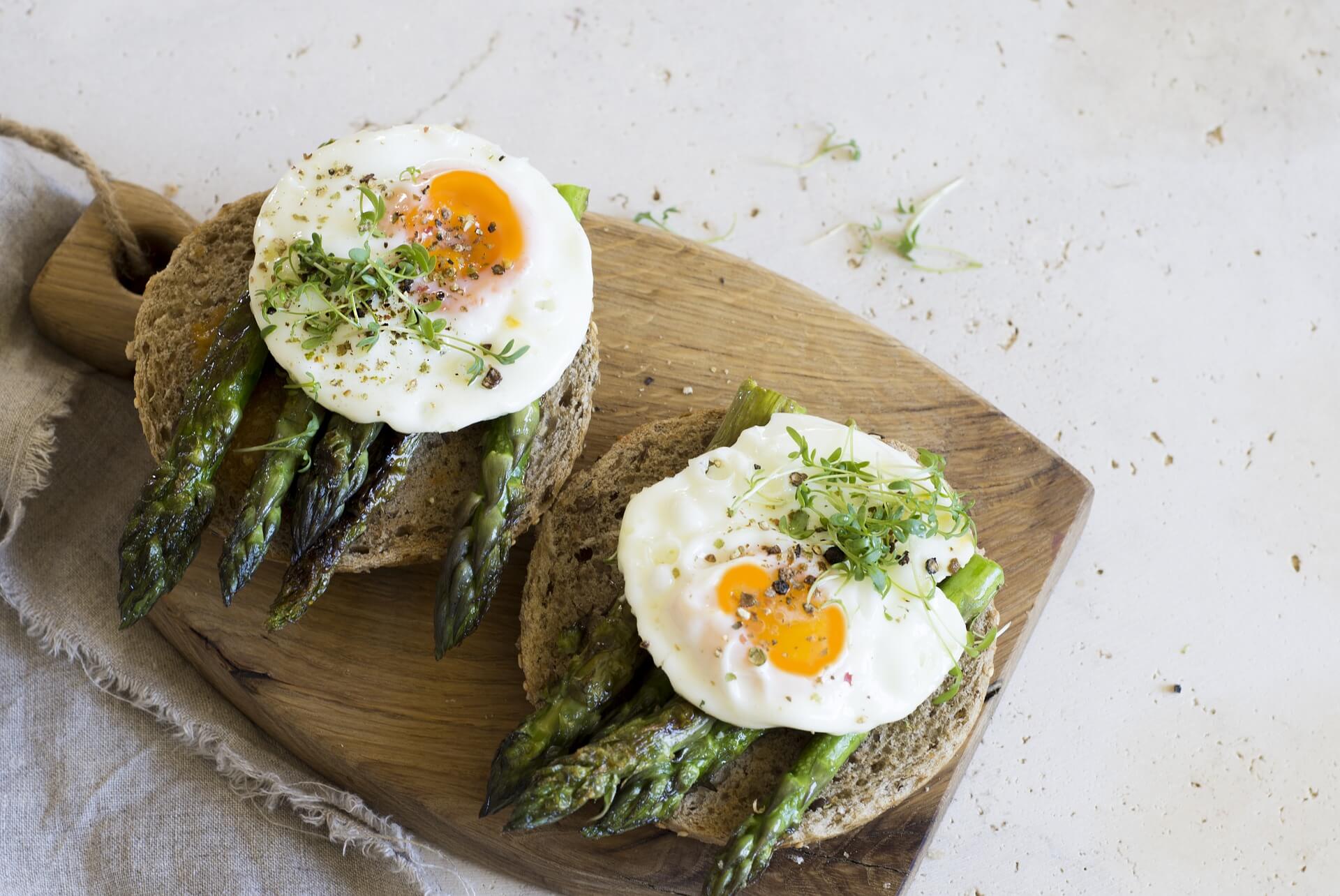 Breakfast: Poached egg on asparagus and sour dough