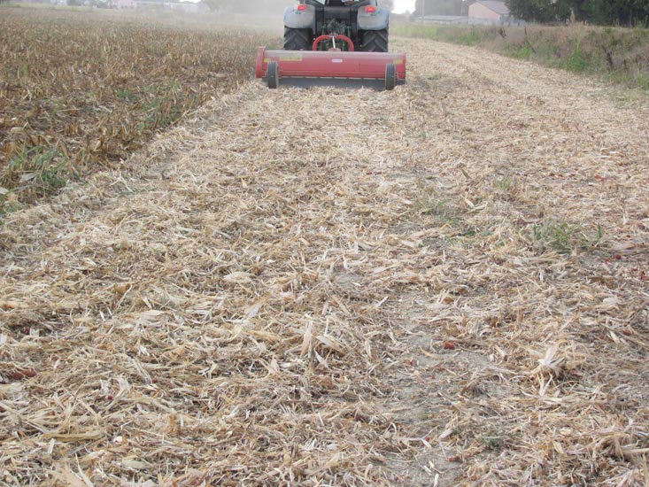 Mulchers cut grass, crop residue/prunings into fine, pieces.  Then spread over the soil. Mulchers are available from Delmade.